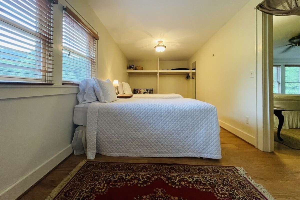A privacy curtain is installed in the doorway between these spaces