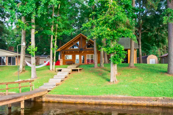 Peaceful lakefront setting with private shoreline & dock access.