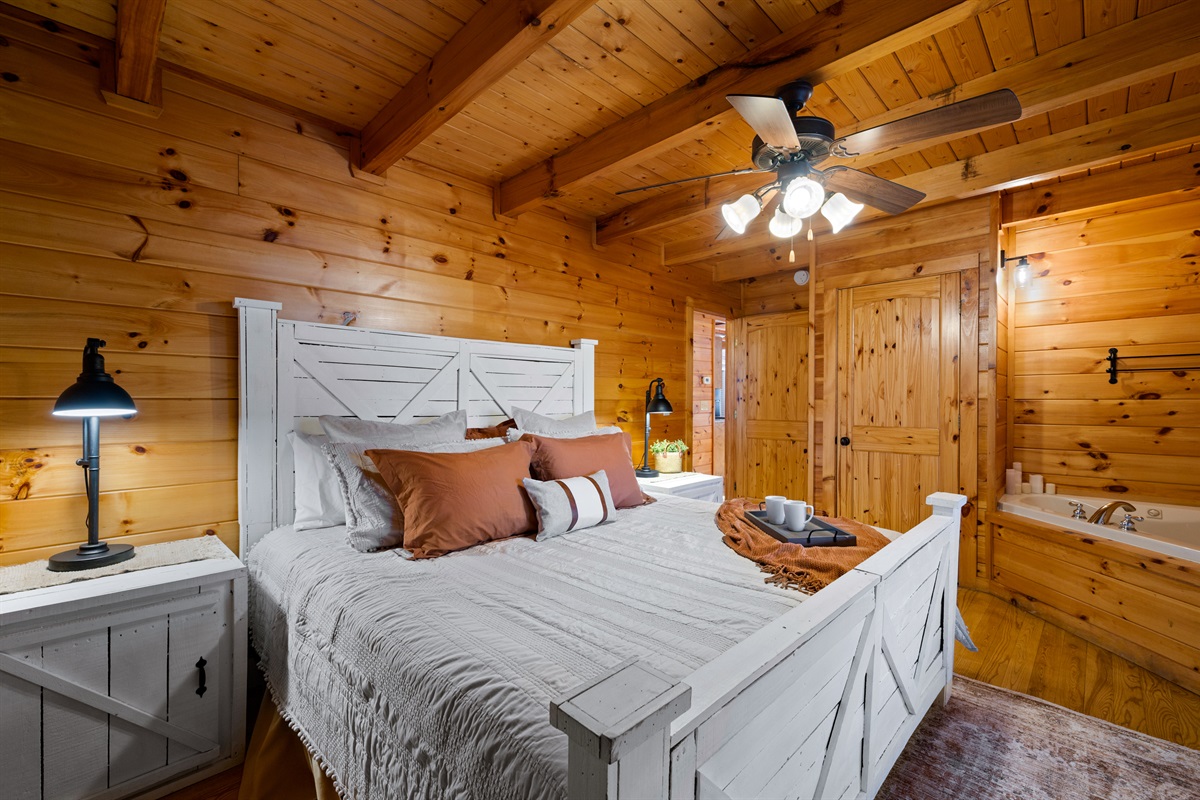 The main floor king suite combines comfort and convenience, featuring a plush king bed and a jetted tub that creates a spa-like retreat within your own space.