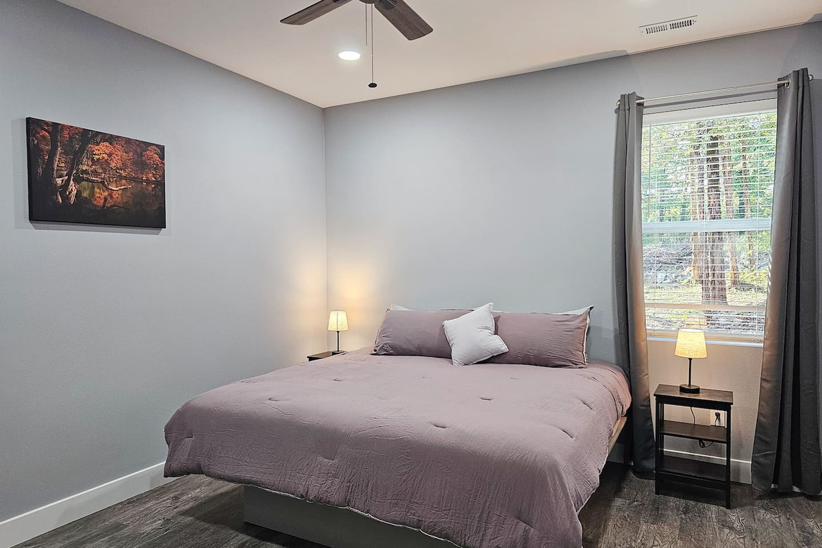 Cozy private King suite with soft modern touches.