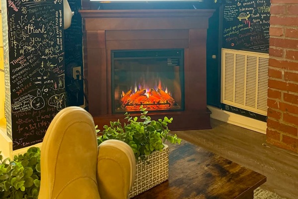 Kick back and relax in our cozy den complete with a 40” smart tv with roku streaming and a remote control electric fireplace.