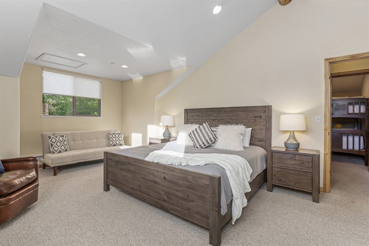 A larger bedroom with comfortable furnishings—perfect for stretching out after a long day.