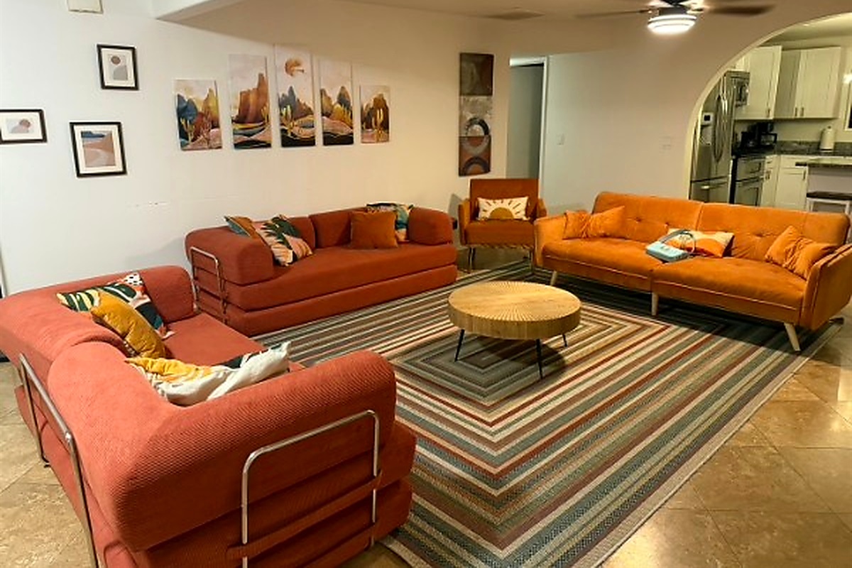 Gather in the cozy living room, where stories flow and movie nights stretch into late laughs 🧡✨