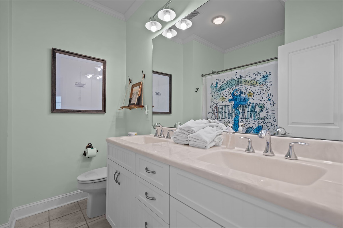 1st floor full bath with double sink and shower/tub combo