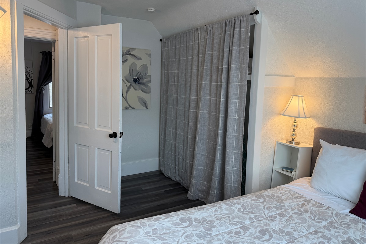 There's a large closet with iron and ironing board, extra blankets and a fan.