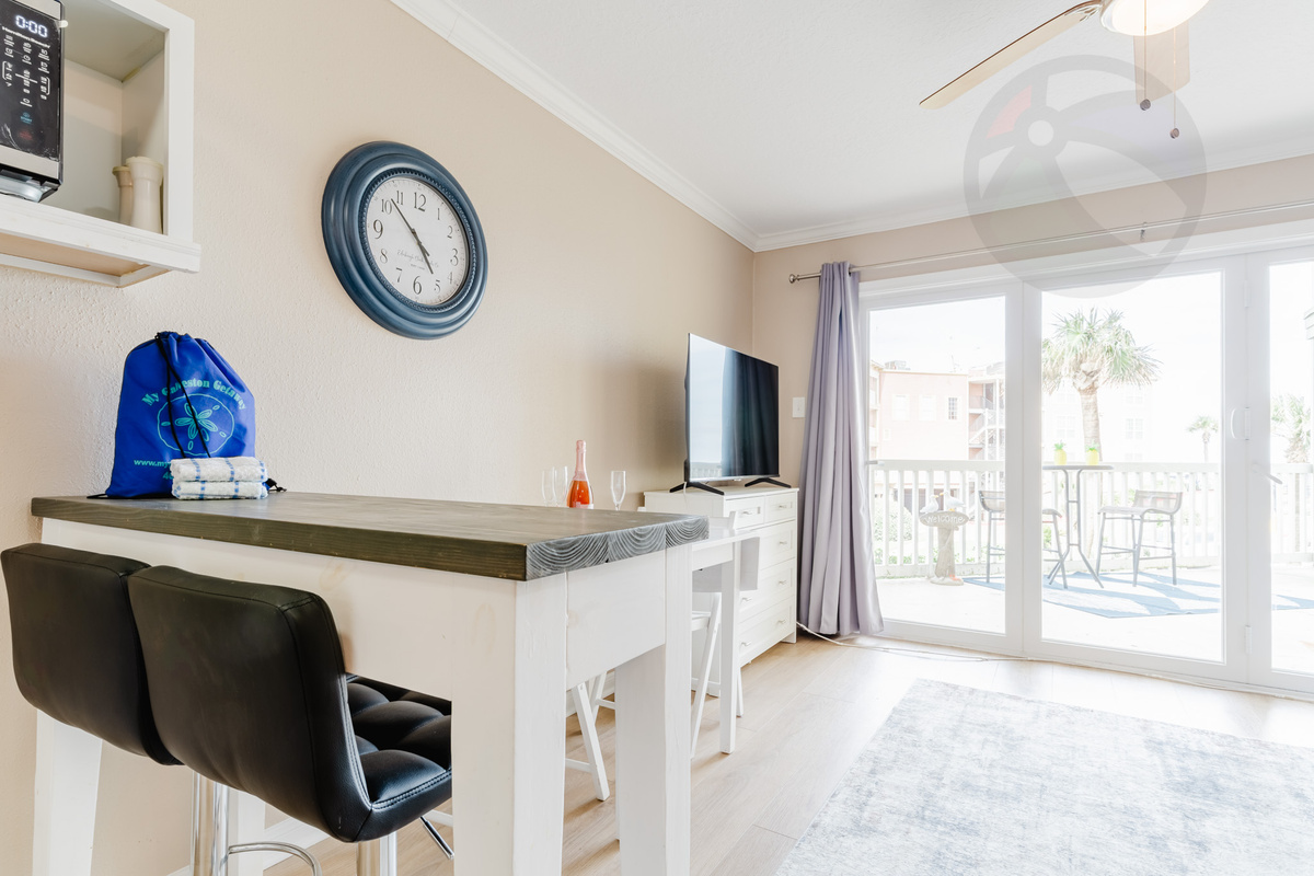 Sit at the breakfast bar, across the balcony you'll see the pool and the gulf