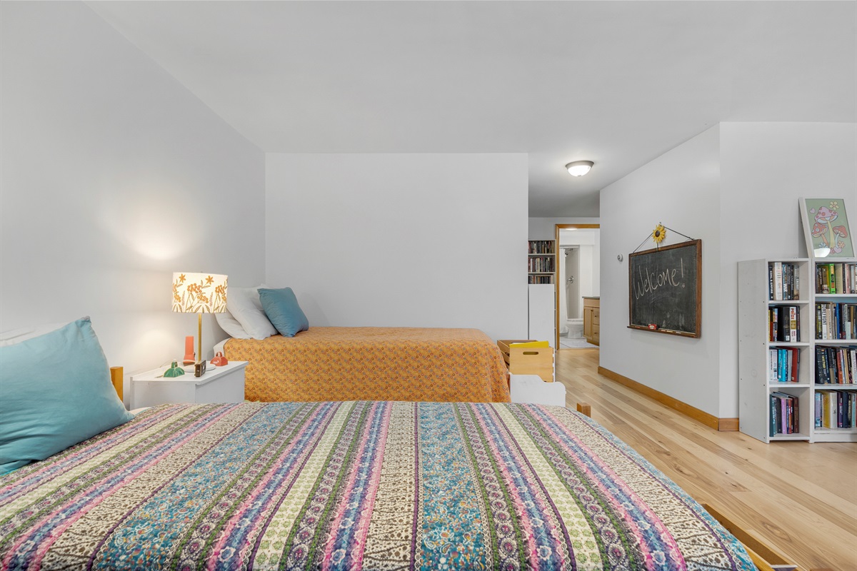 Twin beds in the lower-level TV/Family room 