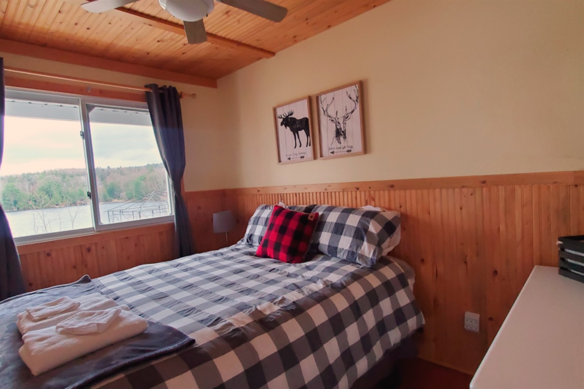 Bedroom with view of lake