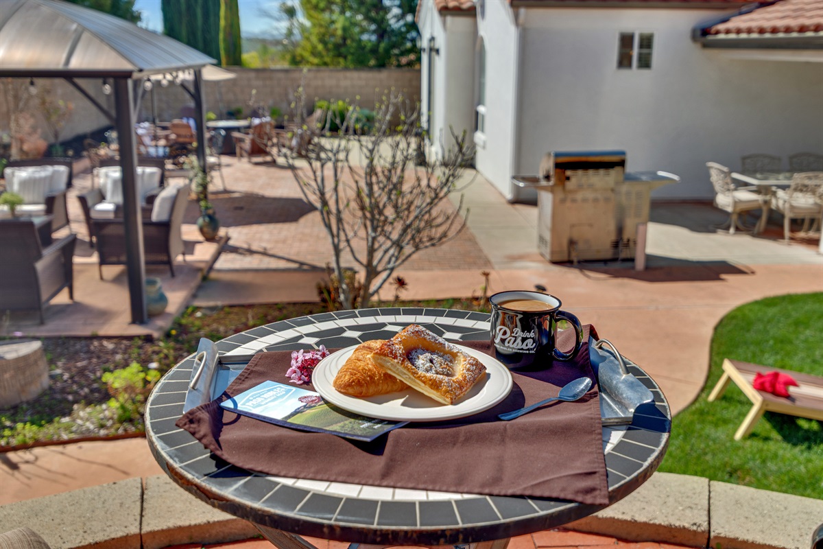 Spacious patio with fire pit, outdoor dining, and lounge seating for an unforgettable trip to Paso.