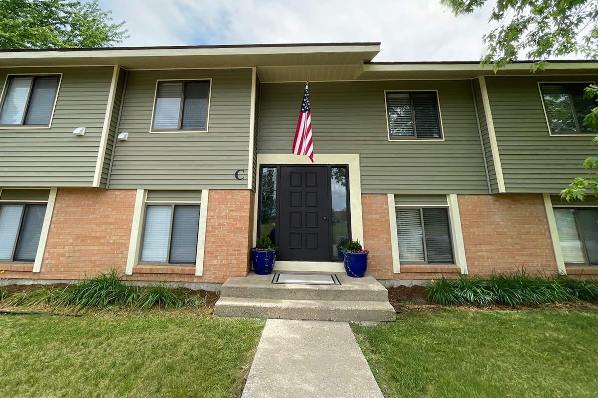 Welcome to your home away from home! This well-kept building features easy entry, a charming front porch with planters, and a peaceful setting surrounded by nature—perfect for a relaxing, private stay with convenient access to all the essentials.