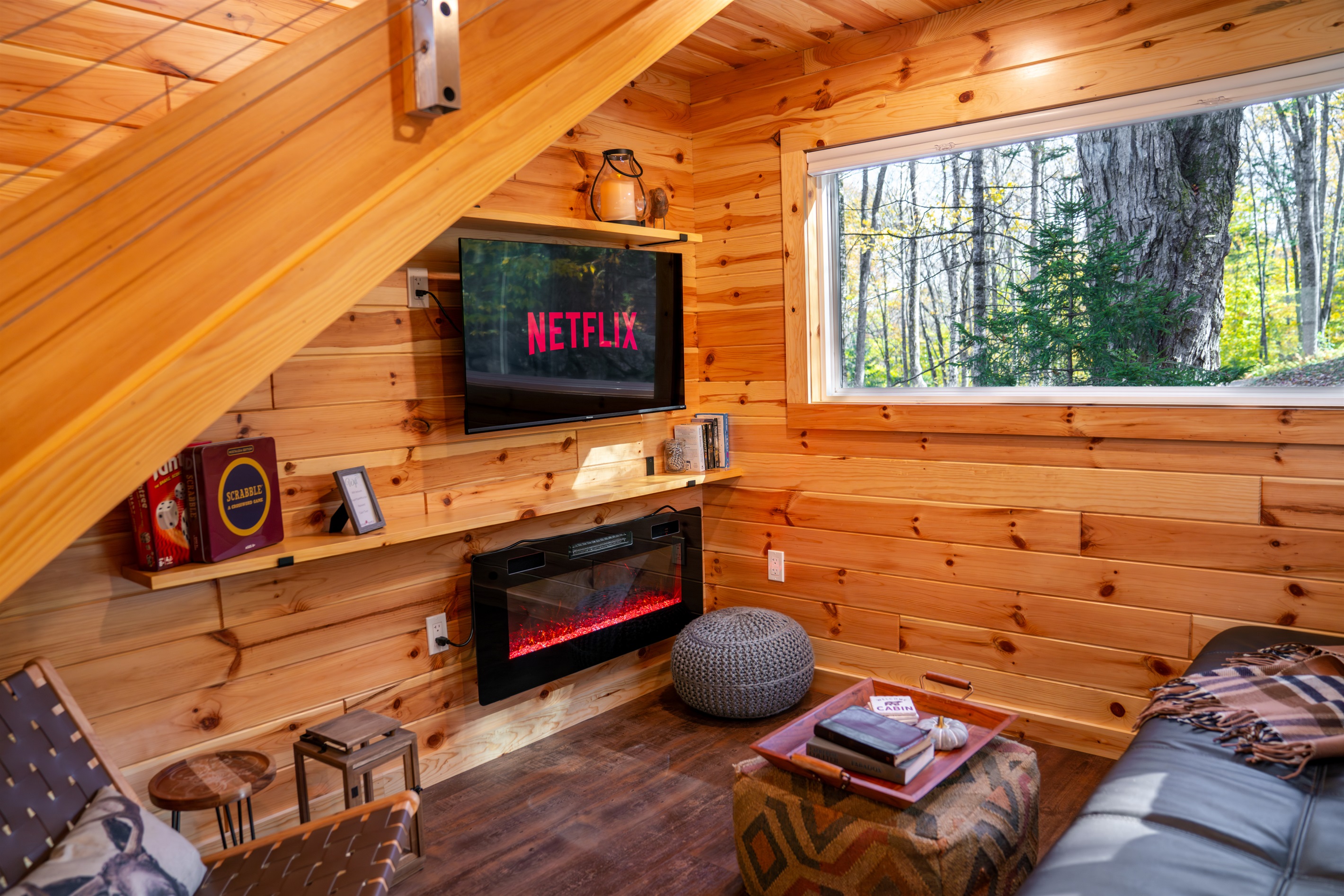Living area with electric fireplace, and Smart/Roku TV