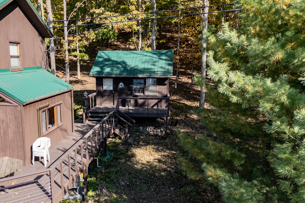 Lower deck walkway and wooded path — easy access to lake and nature.