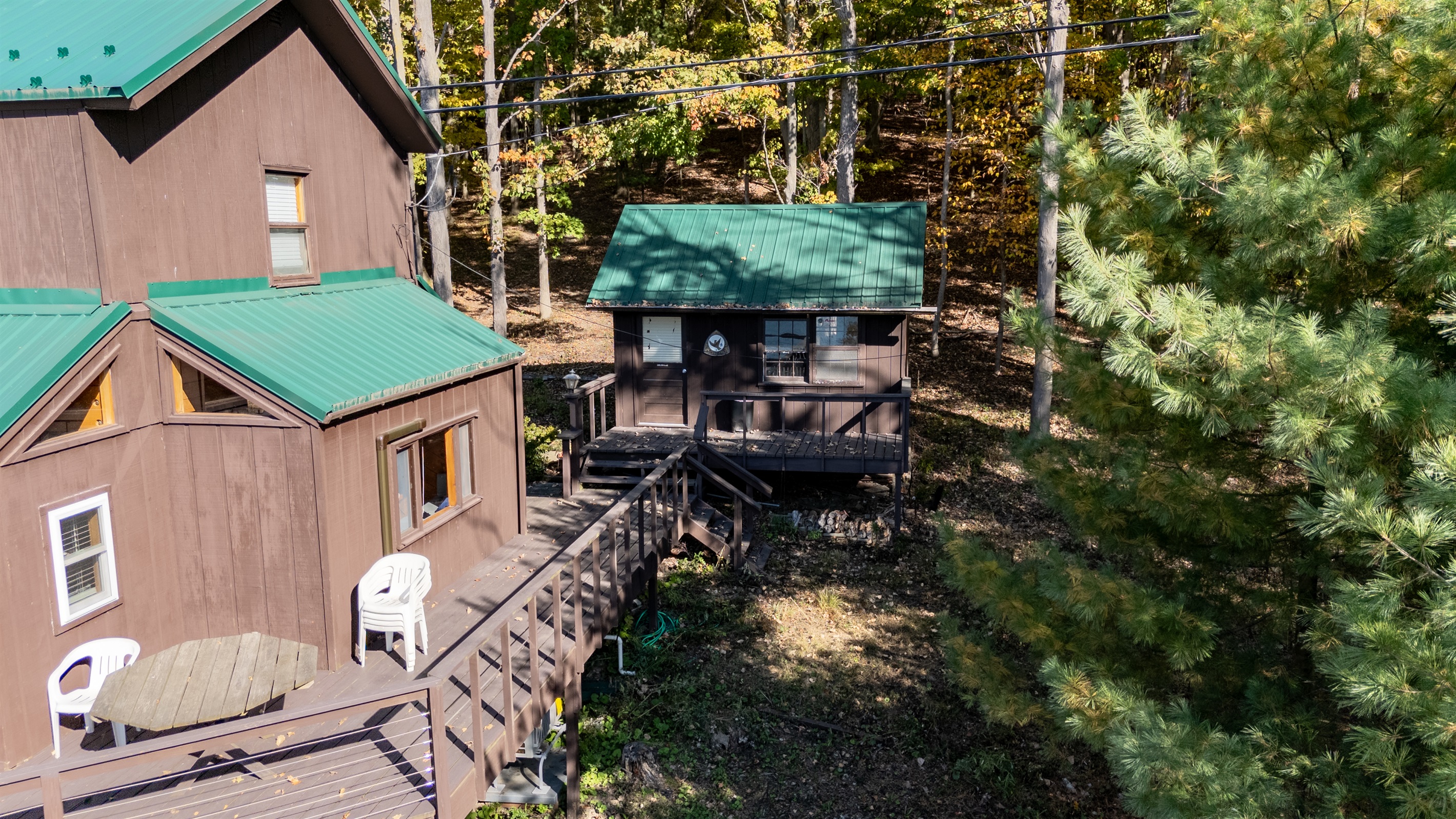 Lower deck walkway and wooded path — easy access to lake and nature.