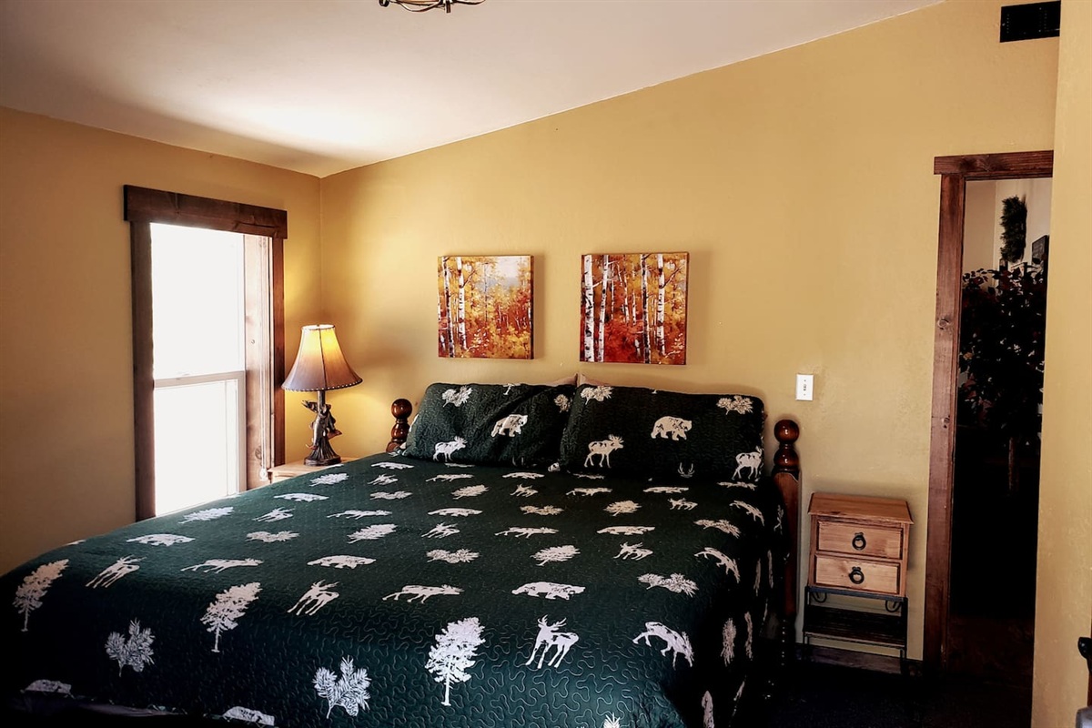 The Guest bedroom with King size bed and access to the wrap around deck