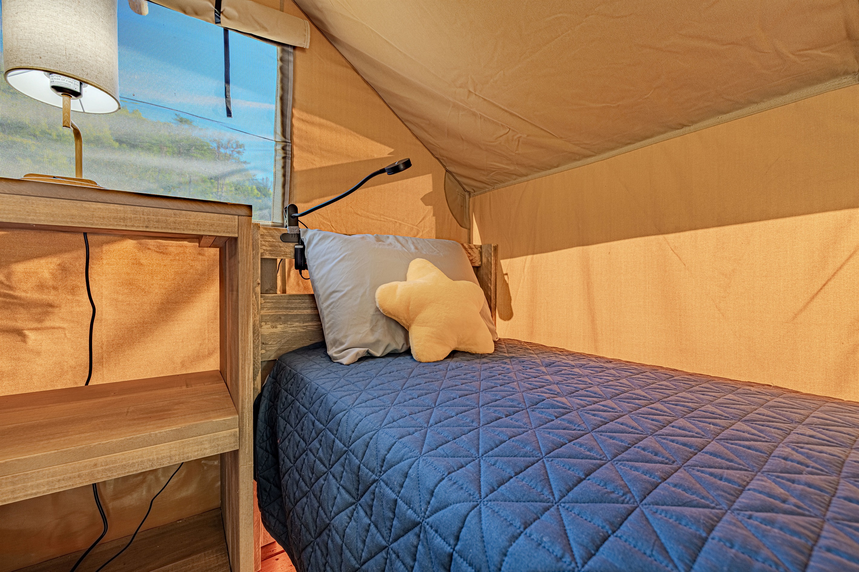 Rest easy after a day of adventure. This cozy, comfortable bed is waiting for you.