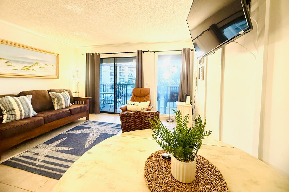 Living and dining area with balcony doors