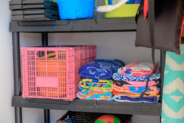 Beach room full of Towels, 10 oversized Beachchairs, Snorkeling gear, Beach Toys, wagon, backyard games, umbrella, mat, and a Cooler!