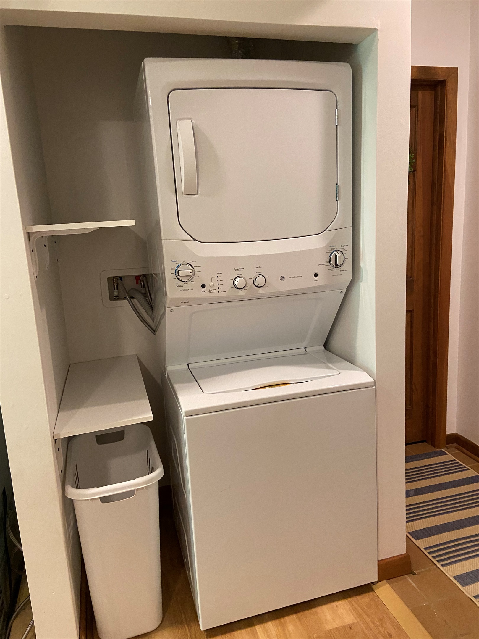 Dedicated laundry area; not pictured: supplied detergent. standing drying rack + iron/ironing board