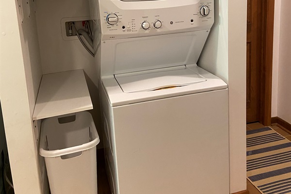 Dedicated laundry area; not pictured: supplied detergent. standing drying rack + iron/ironing board