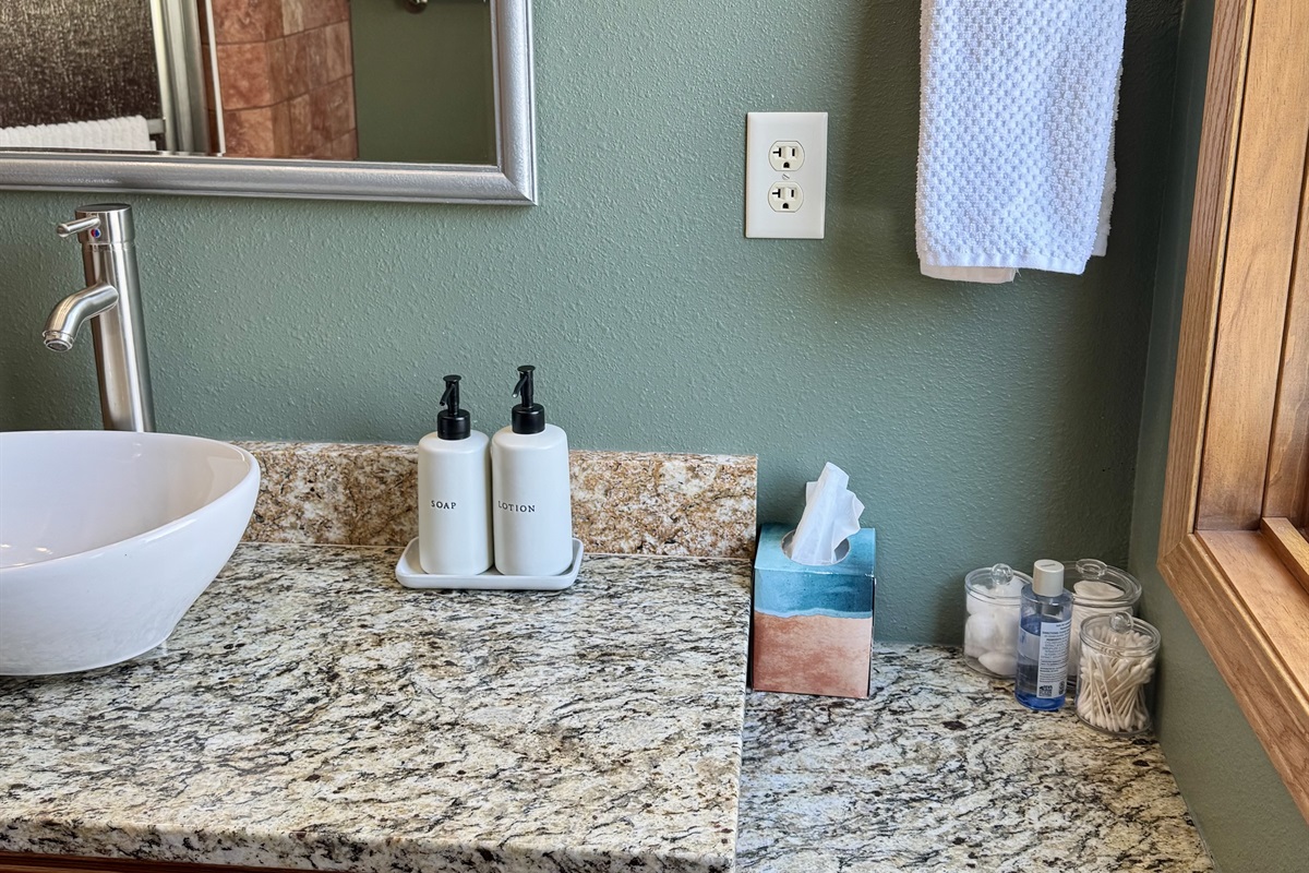 Provided toiletries makeup remover cotton pads q tips. Wooded views firepit and parking/ driveway out two large windows 