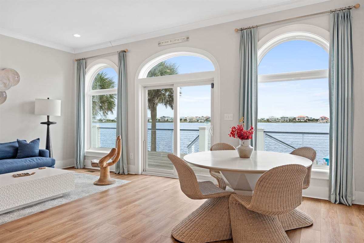 Cozy dining nook beside panoramic water views, perfect for morning coffee or evening cocktails