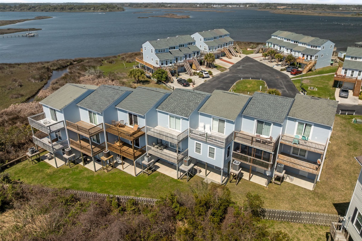 Rear view of townhomes along the water