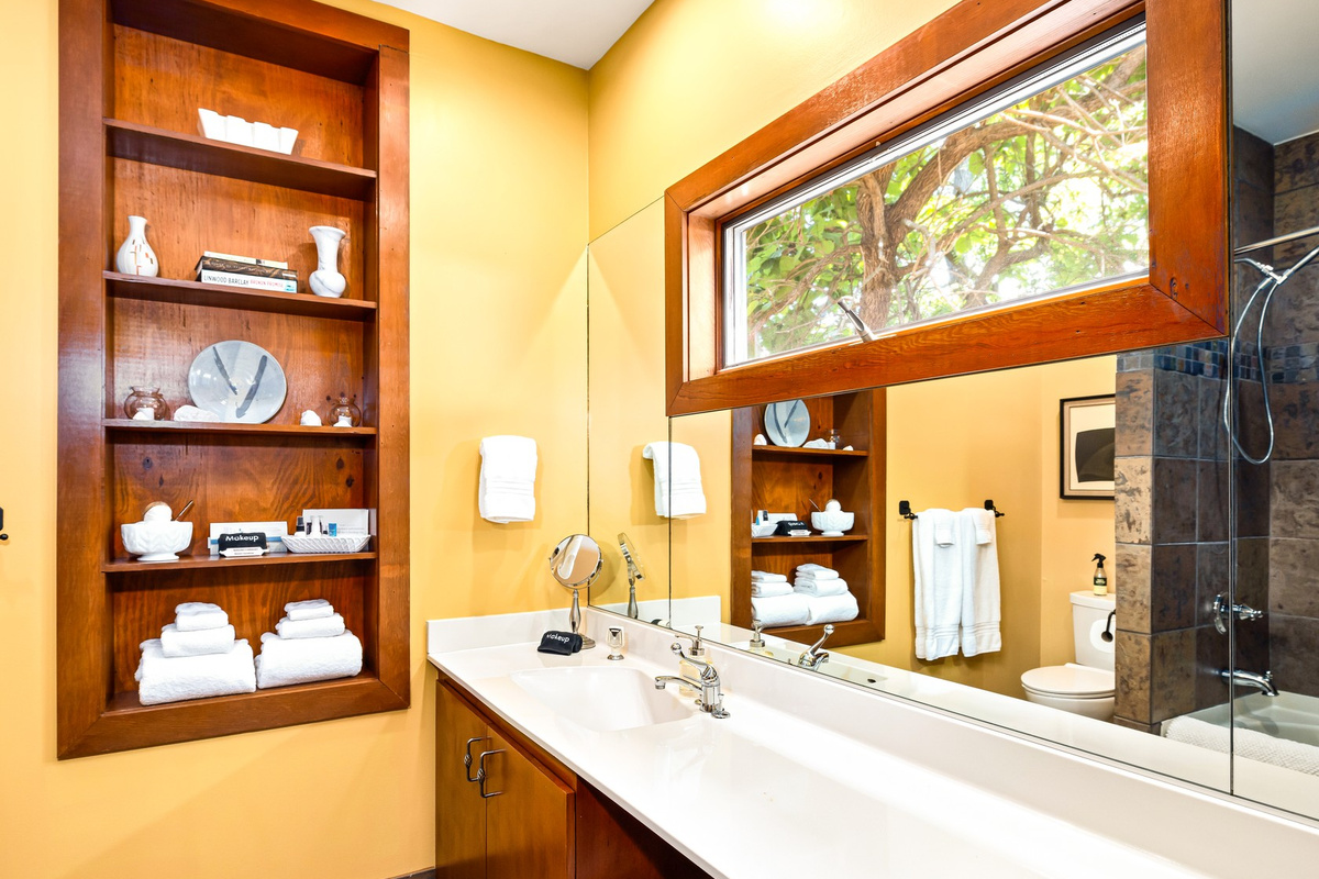 Spacious Skyview en-suite bath is the largest lower floor bathroom with space for two to get ready at once. Watch wild birds out the privacy height window! Drawers for storage and plentiful towels.