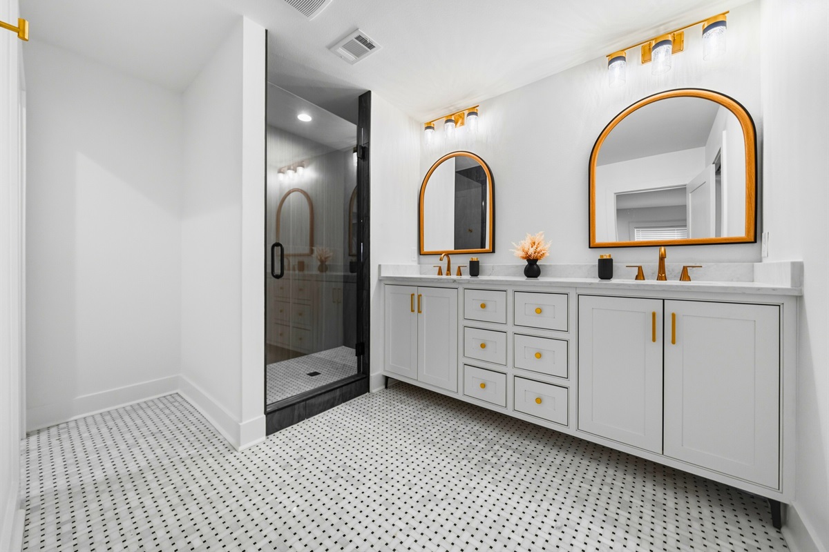 Designed with both style and comfort in mind, the large walk-in shower and clean finishes create a fresh bathroom space.