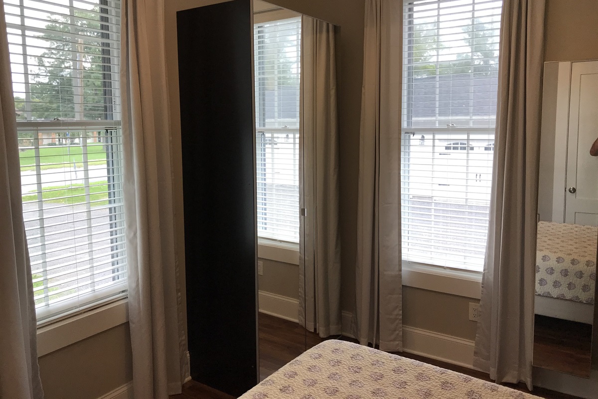 Natural light in bedroom with closet in the middle