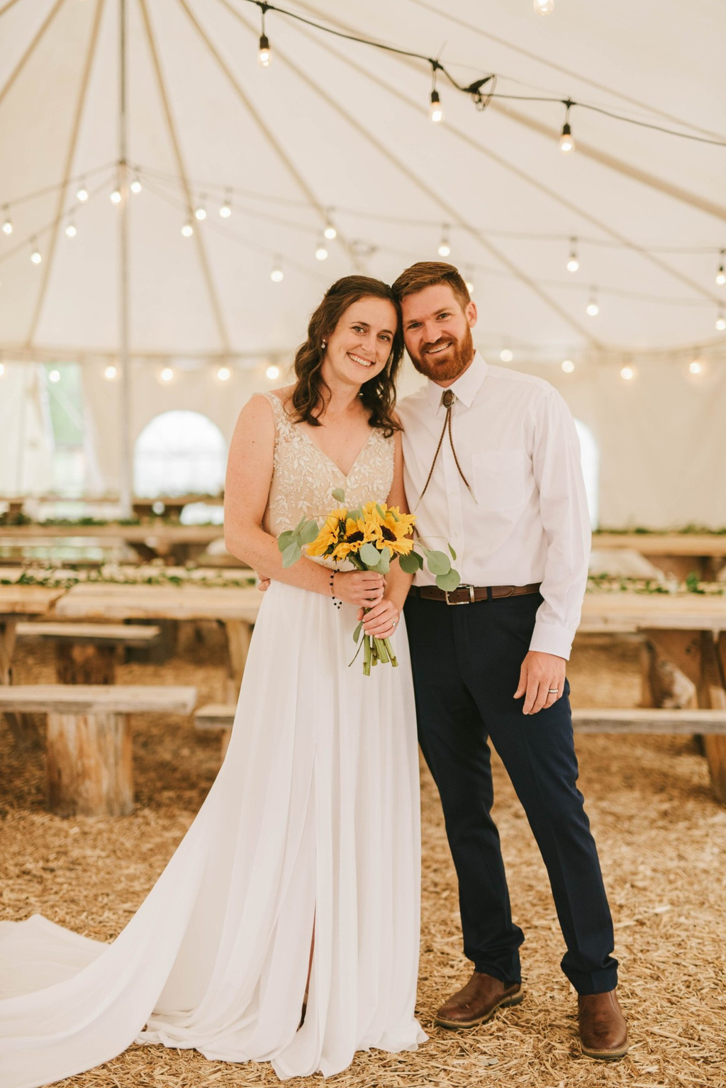 Bride and groom inside the reception tent