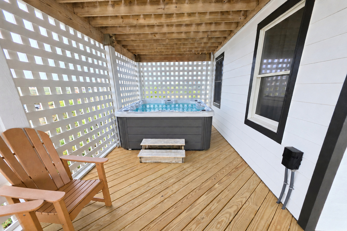 Hot tub tucked away in a private corner of the mid level deck with ocean views. 