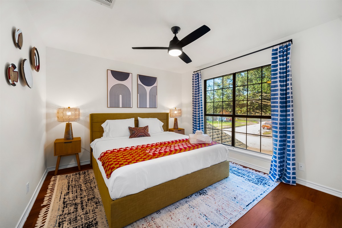 A spacious guest room with King-sized comfort and window serenity.