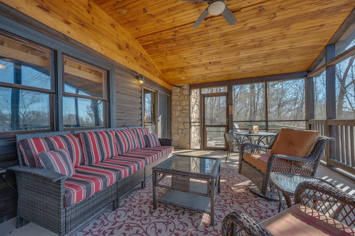 Main level screened in porch with plenty of seating