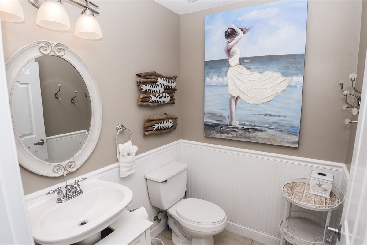 A Half Bath At Entrance