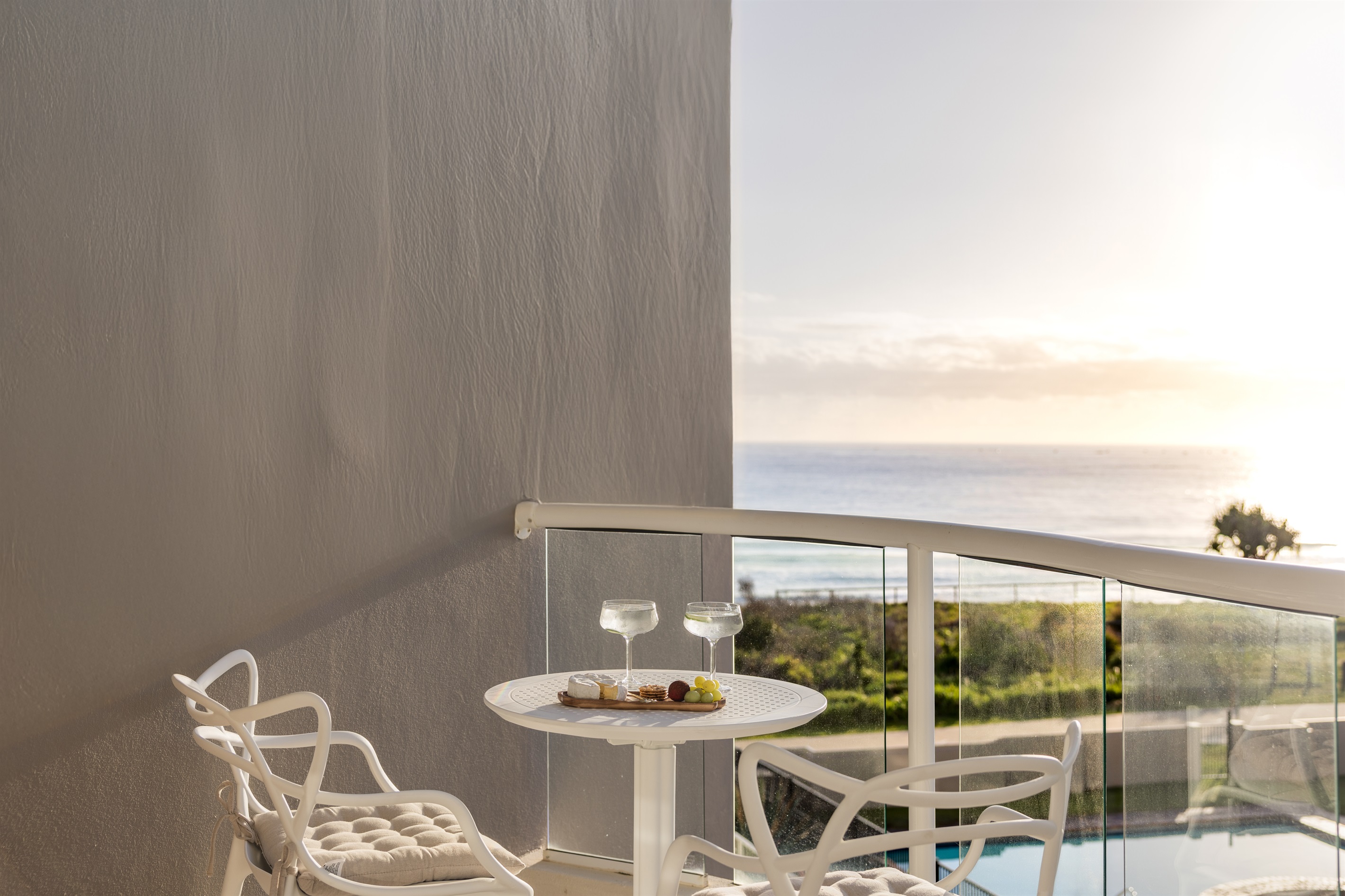 Relax on your private balcony with stunning ocean views 