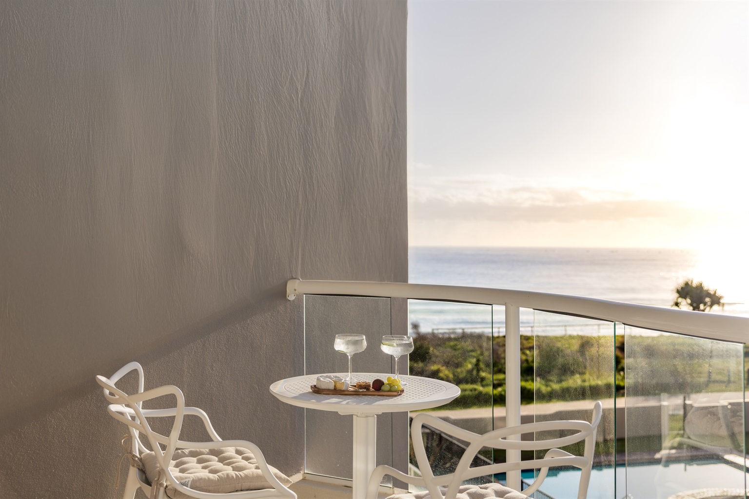 Relax on your private balcony with stunning ocean views 