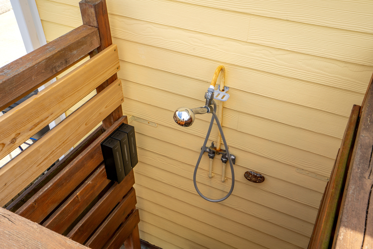 Private outdoor shower, perfect after a day at the beach!