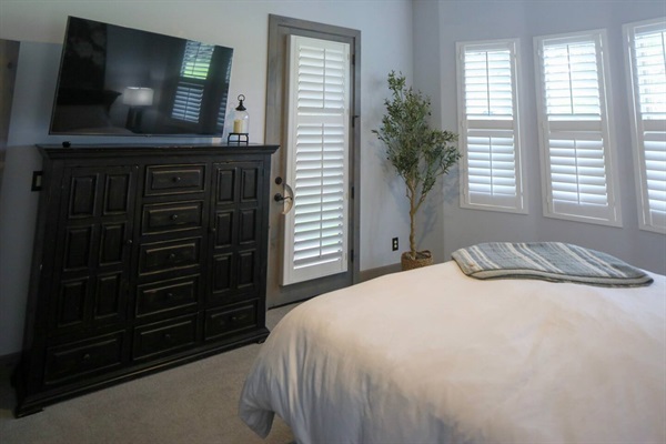 master bed with direct access to back patio