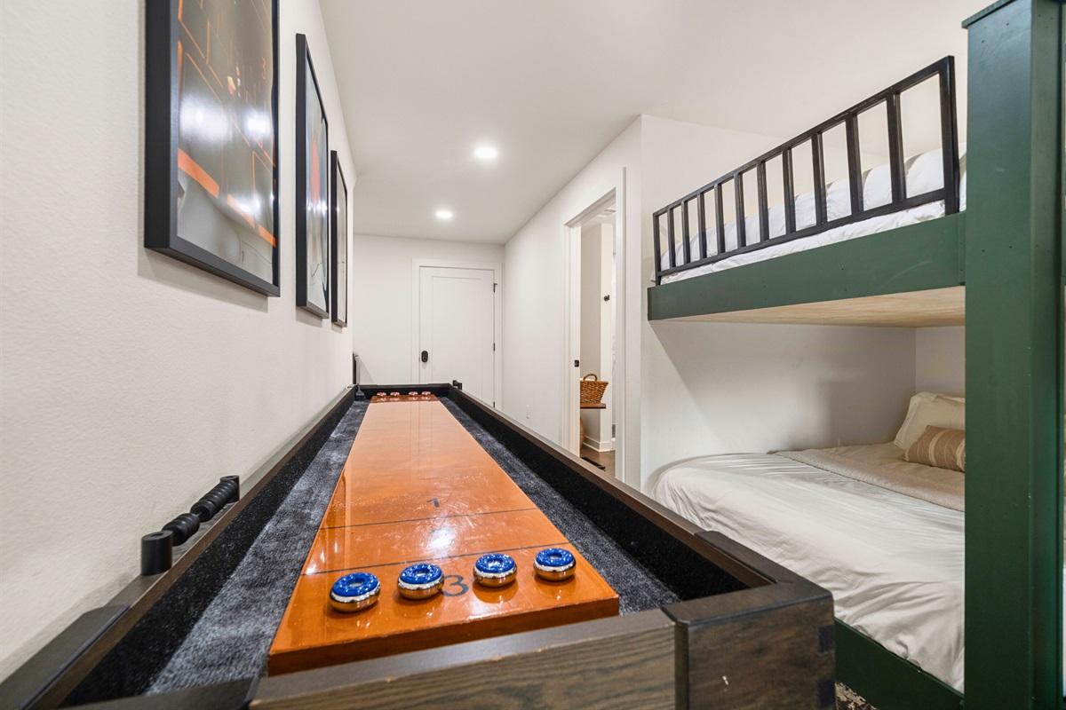 Game time! Enjoy shuffleboard and friendly competition in the fun lower-level rec area.