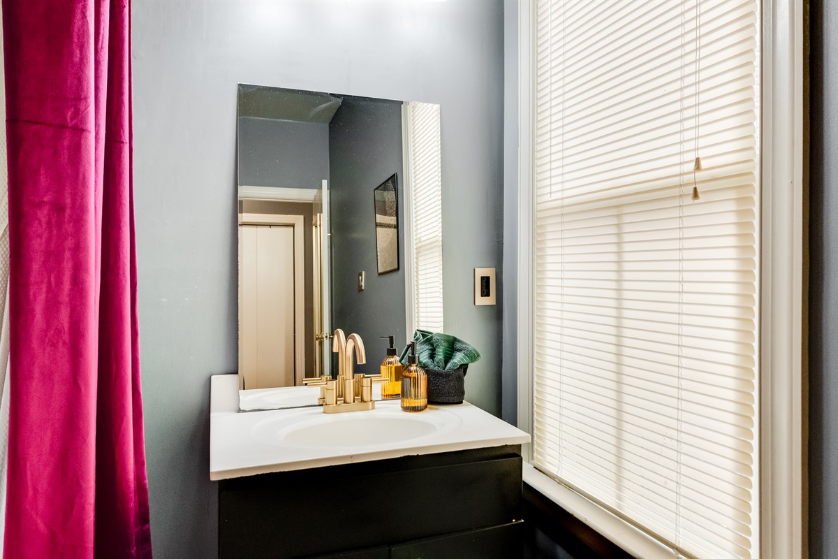 Ensuite to BR3: Elegant gold fixtures and natural light to refresh your day!