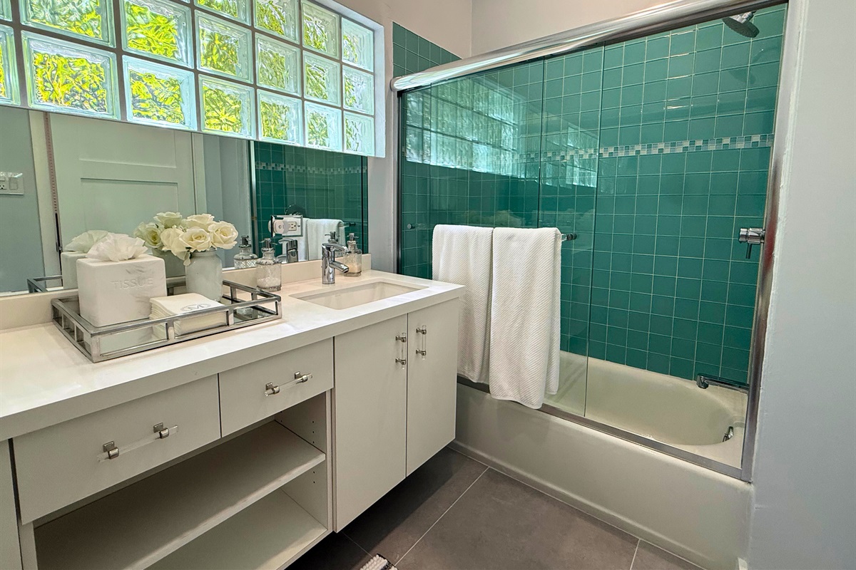 A gorgeous and well appointed bathroom on the lower level