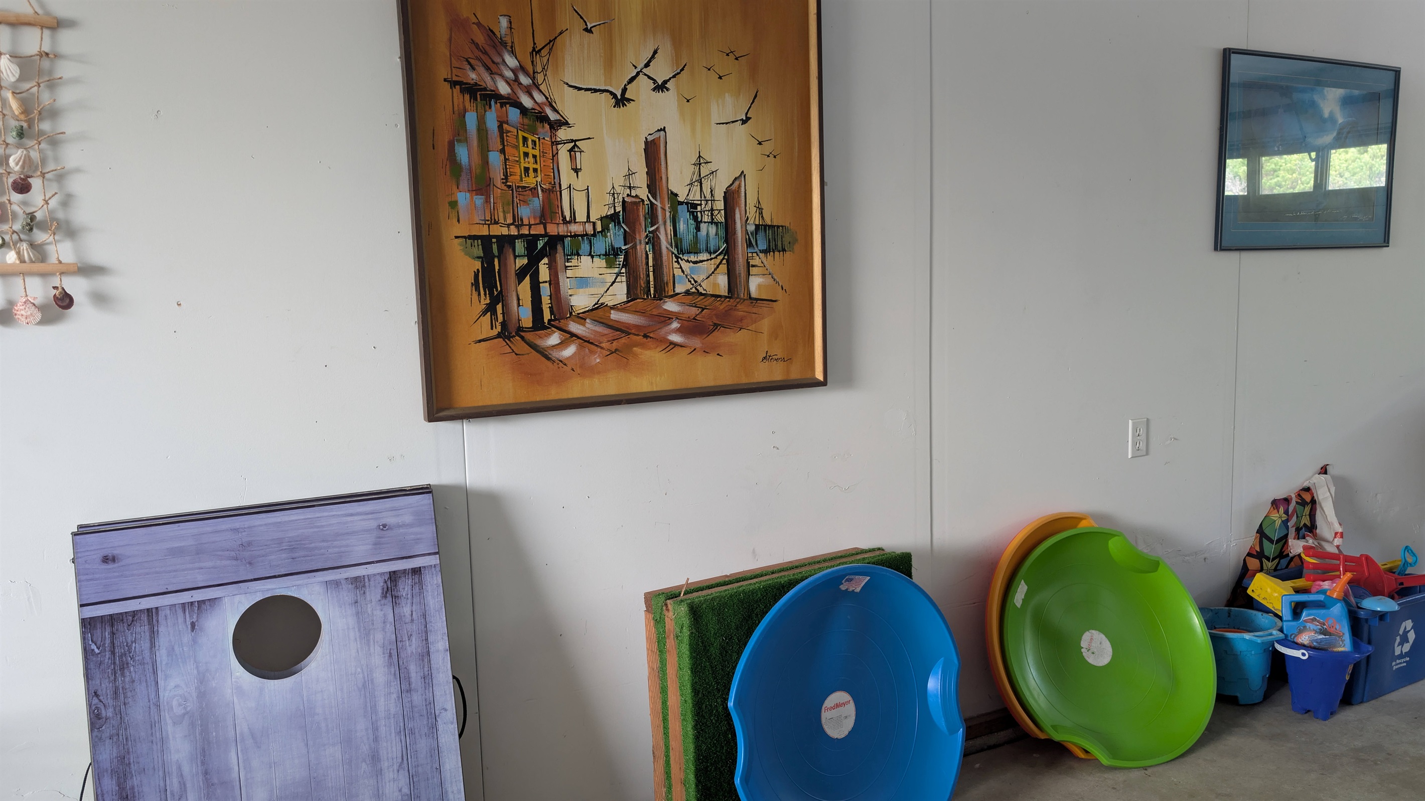 Other games and beach toys in the garage.  Cornhole, sand saucers sand castle building toys