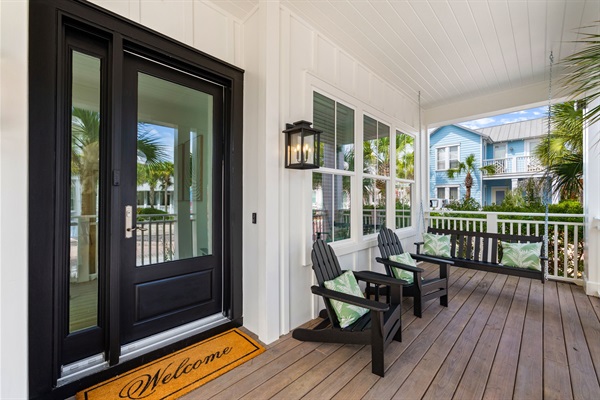 Start the day with a cup of coffee and the sound of the neighborhood waking up. This spacious front porch is made for slow mornings, friendly conversations, and settling into the relaxed rhythm of 30A.