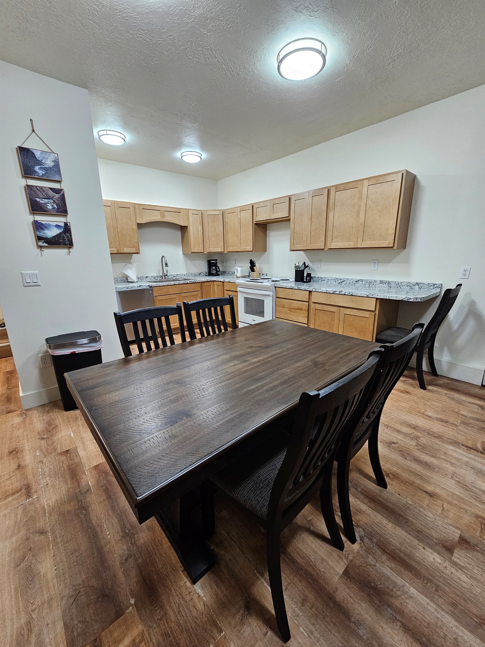 Full Kitchen with Dishwasher, Stove, and Refrigerator / Dining Room