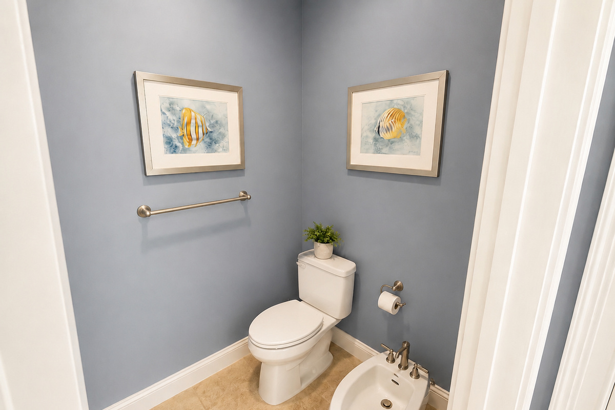 Primary suite toilet room with toilet and bidet