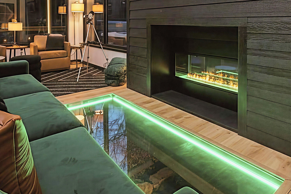 Watch the creek flow beneath your feet while cozying up in the luxury furnished living space. A glass floor provides a private view to the creek flowing under the cabin - this is not your typical stay