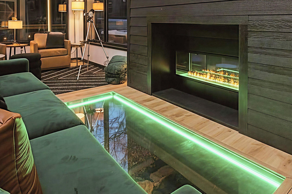 Watch the creek flow beneath your feet while cozying up in the luxury furnished living space. A glass floor provides a private view to the creek flowing under the cabin - this is not your typical stay