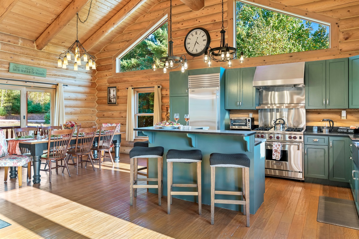 Bright, open kitchen with a bar and dining space.