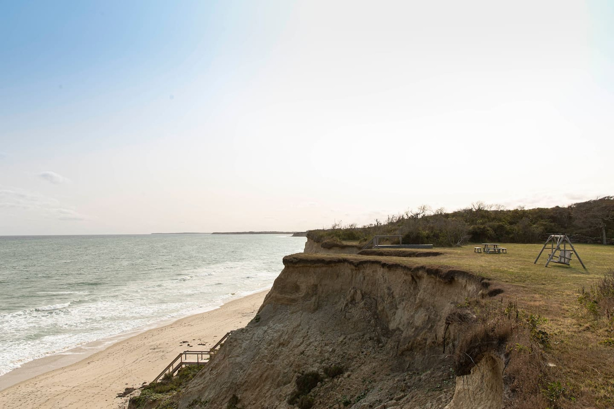 Another view of the cliff, your front yard, and private stairs to your private beach