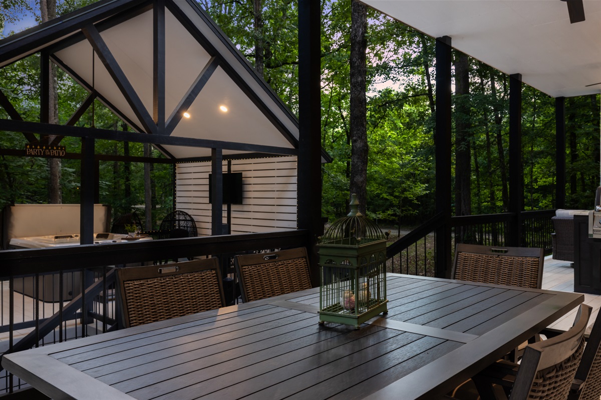 Covered outdoor dining surrounded by the trees &mdash; the ultimate cabin reset 🍷
